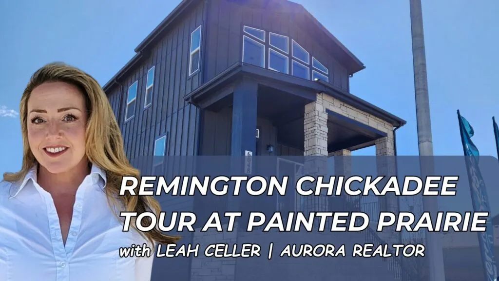 Front view of the Remington Chickadee model home in Painted Prairie, featuring a spacious deck, modern design, and stunning mountain views.